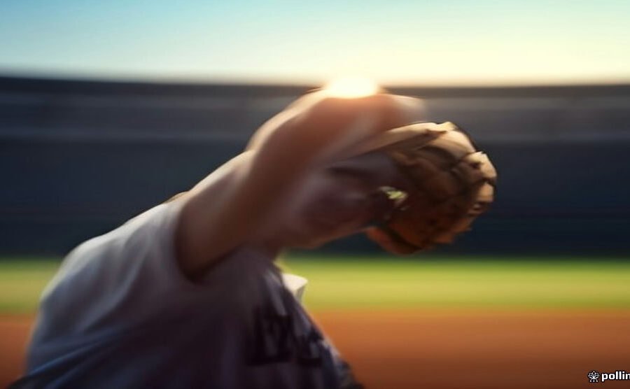 Tall MLB pitcher releasing a fastball from the mound at a baseball stadium